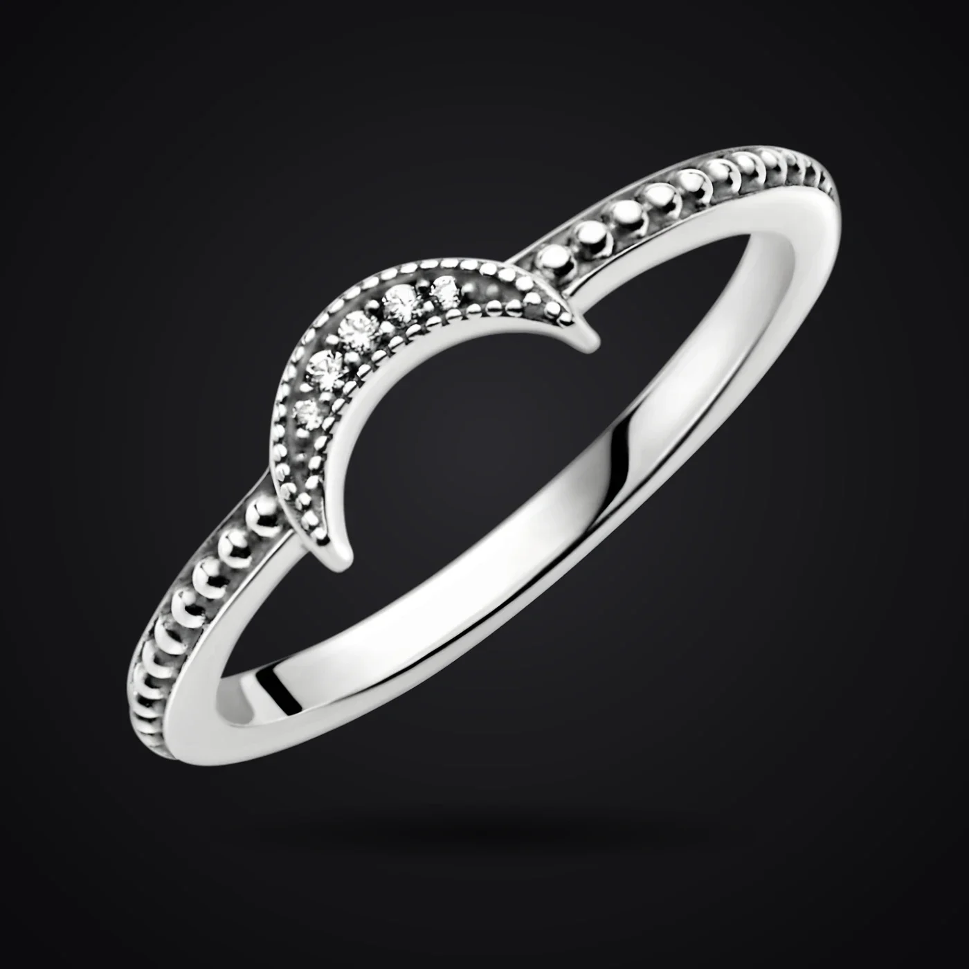 Crescent Moon ring on a dark background
