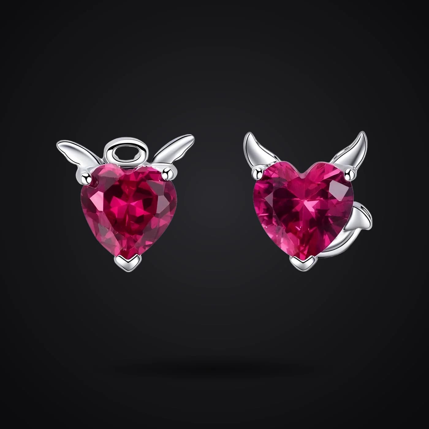 Angel & Demon earrings on a dark background