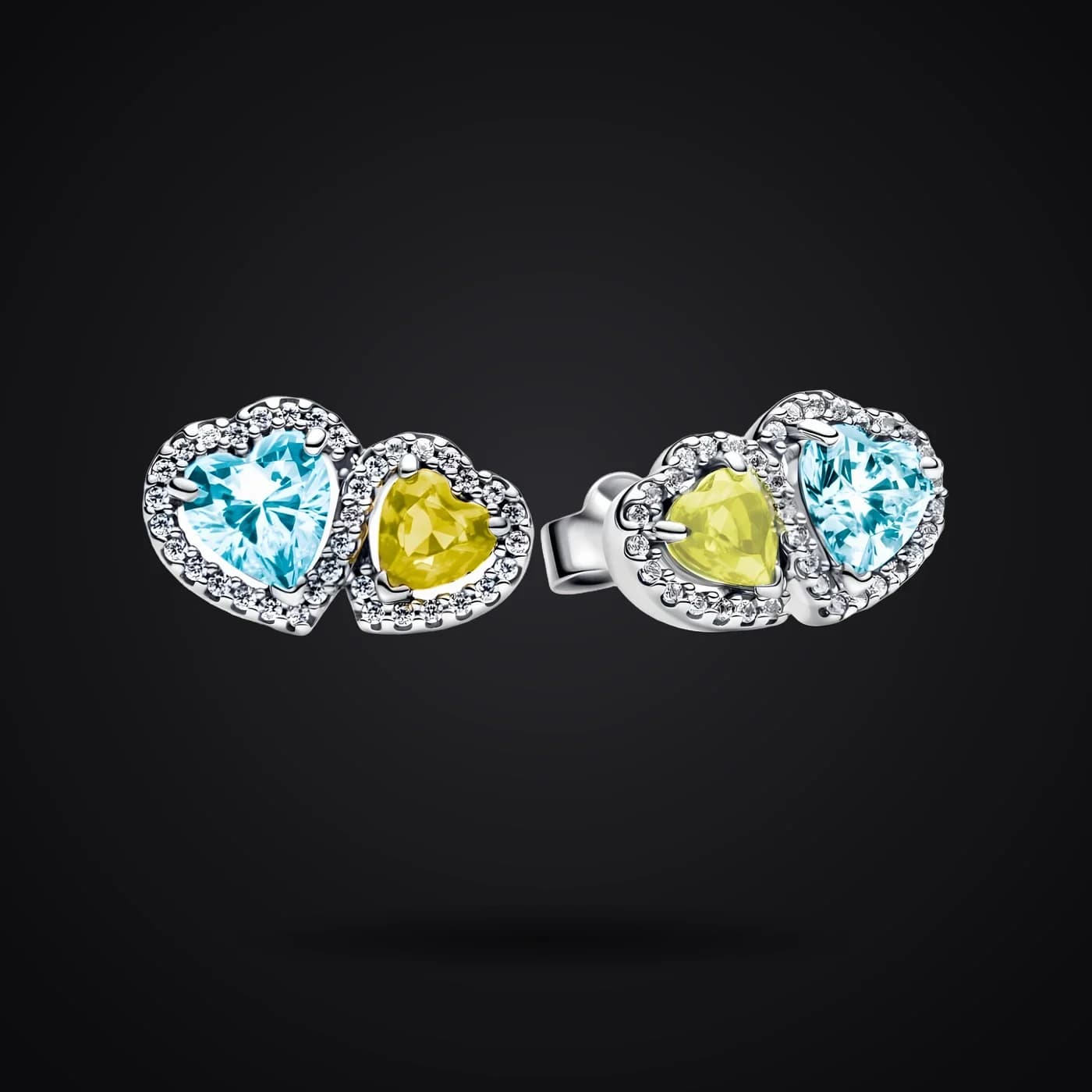 Harmony of Light earrings on a dark background