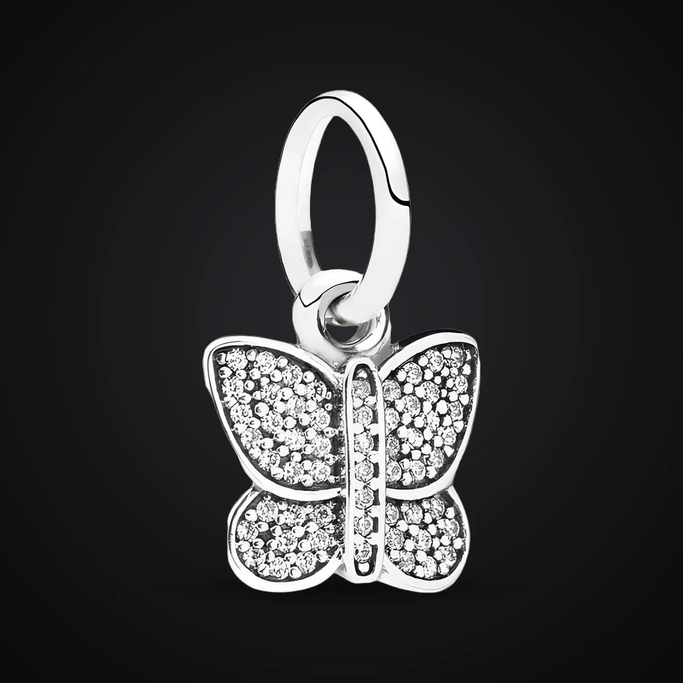 Butterfly charm on a dark background