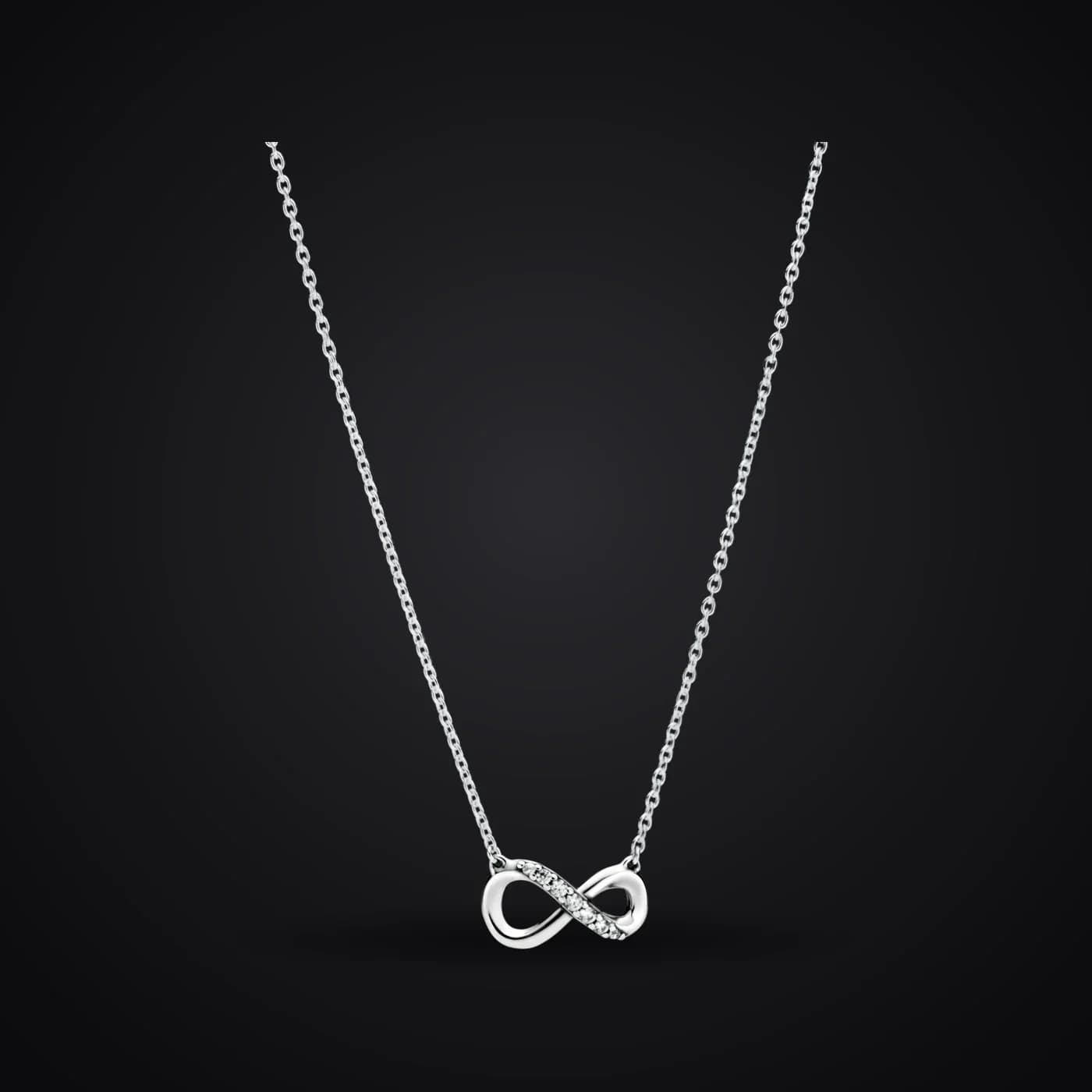 Infinity necklace on a dark background