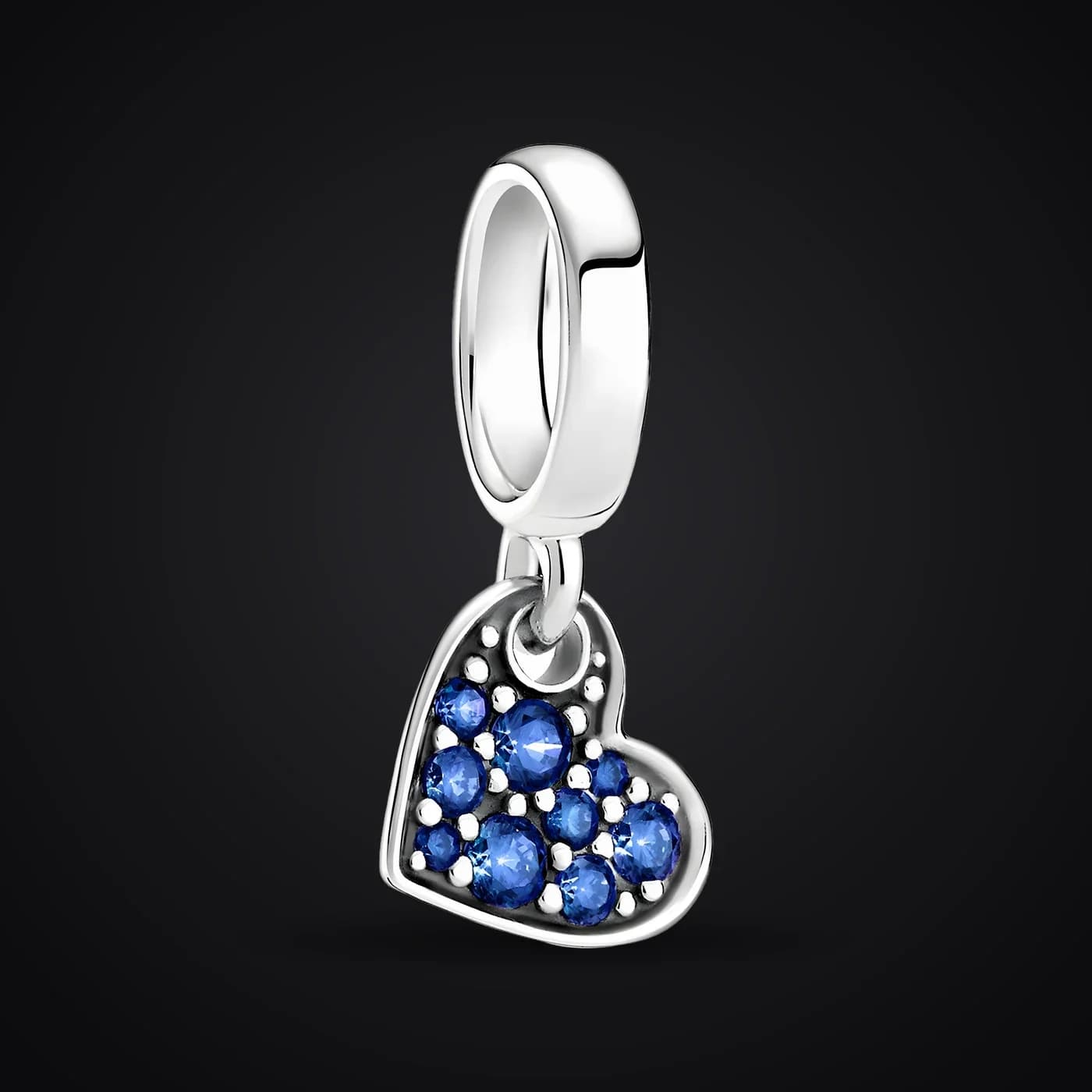 Blue Heart charm on a dark background