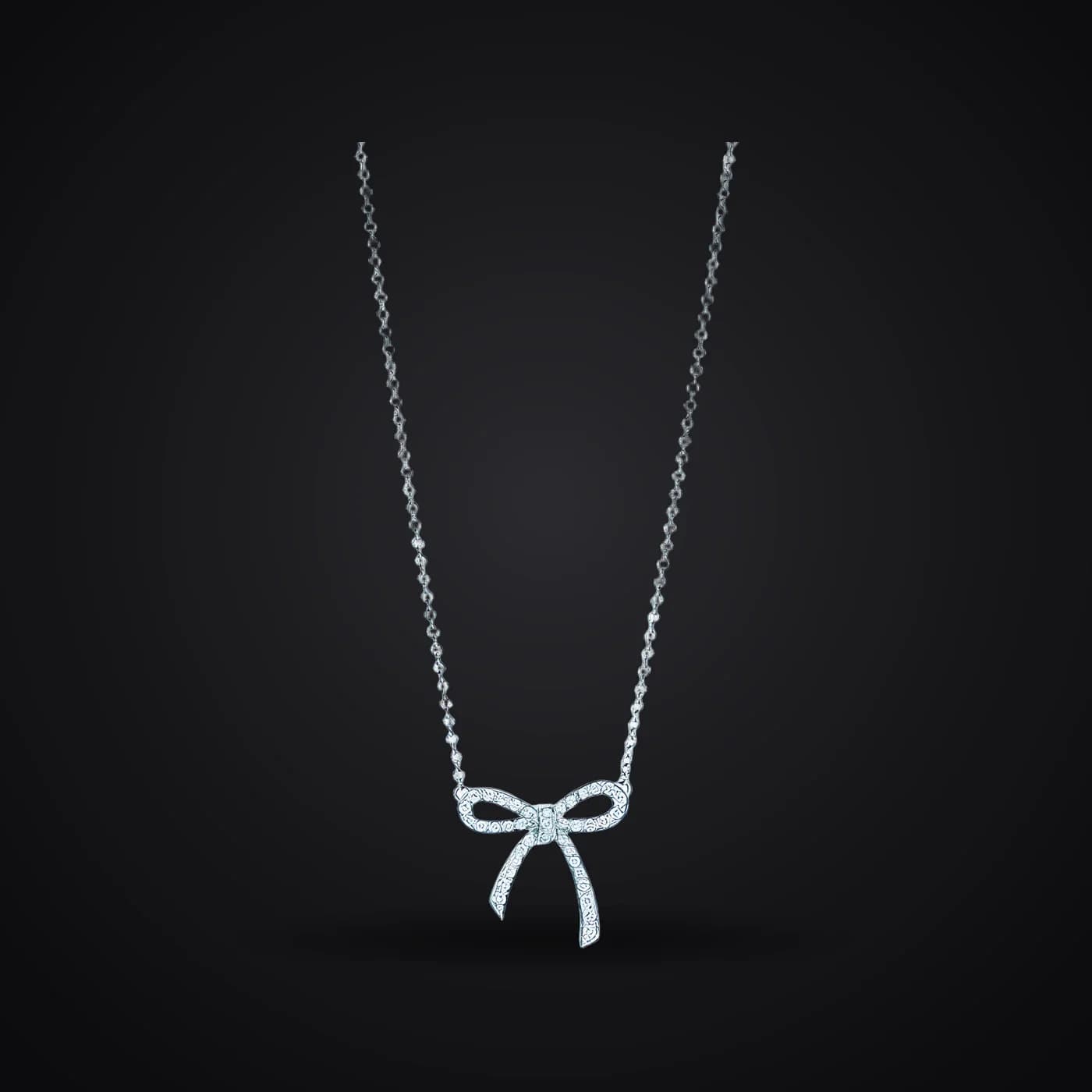 Sparkling Bow necklace on a dark background