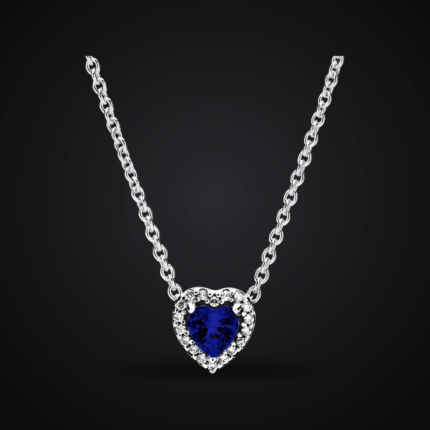 Blue Heart necklace on a dark background