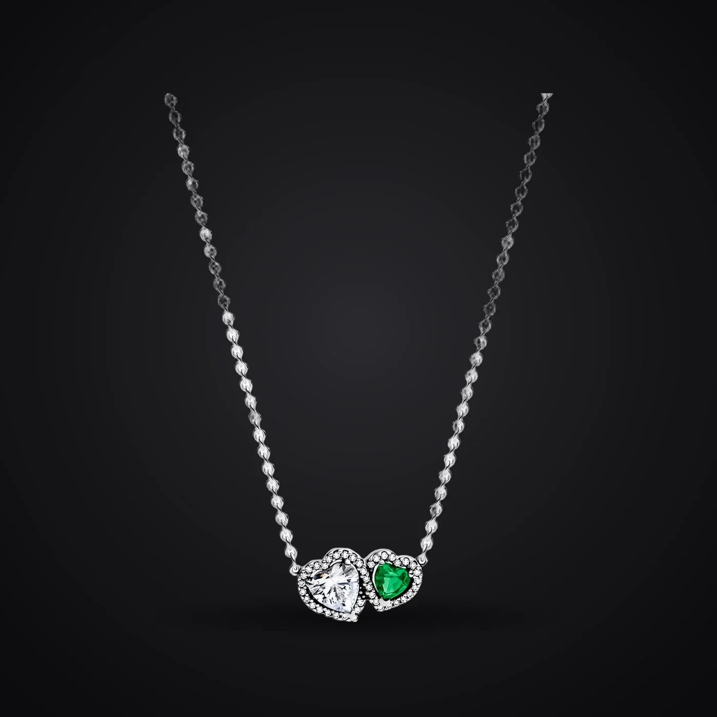 Harmony Hearts necklace on a dark background