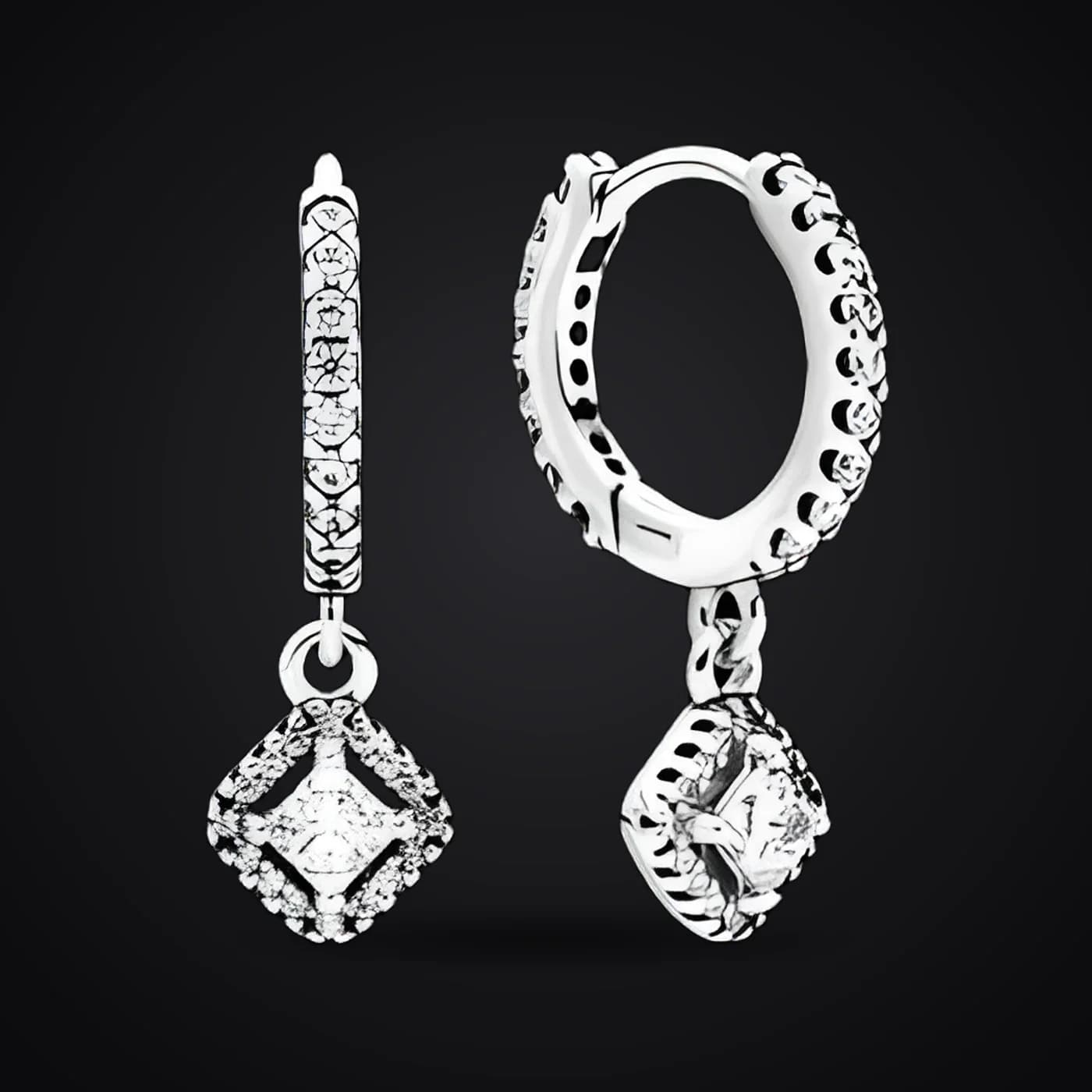 Sparkle earrings on a dark background