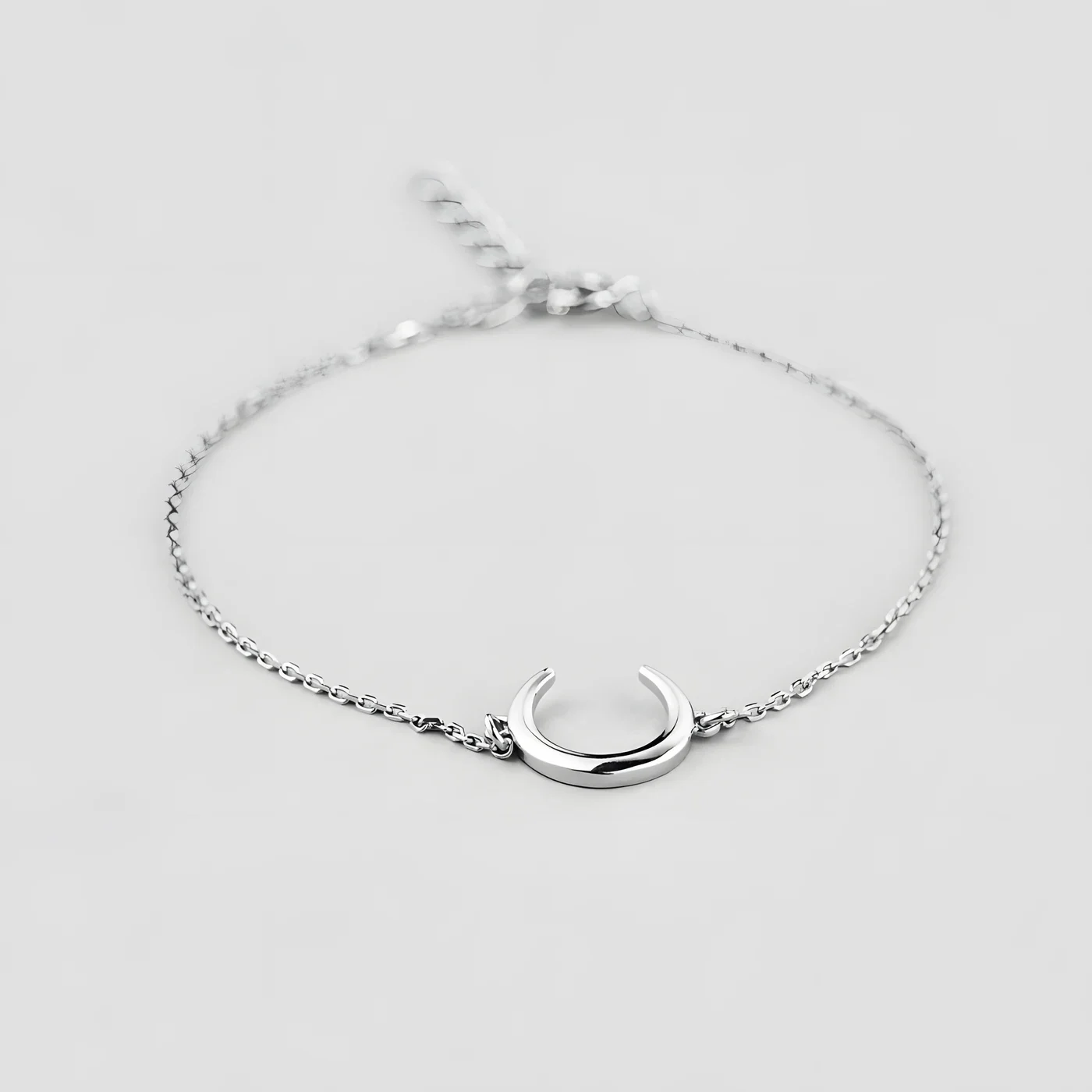 Crescent Moon bracelet on a dark background