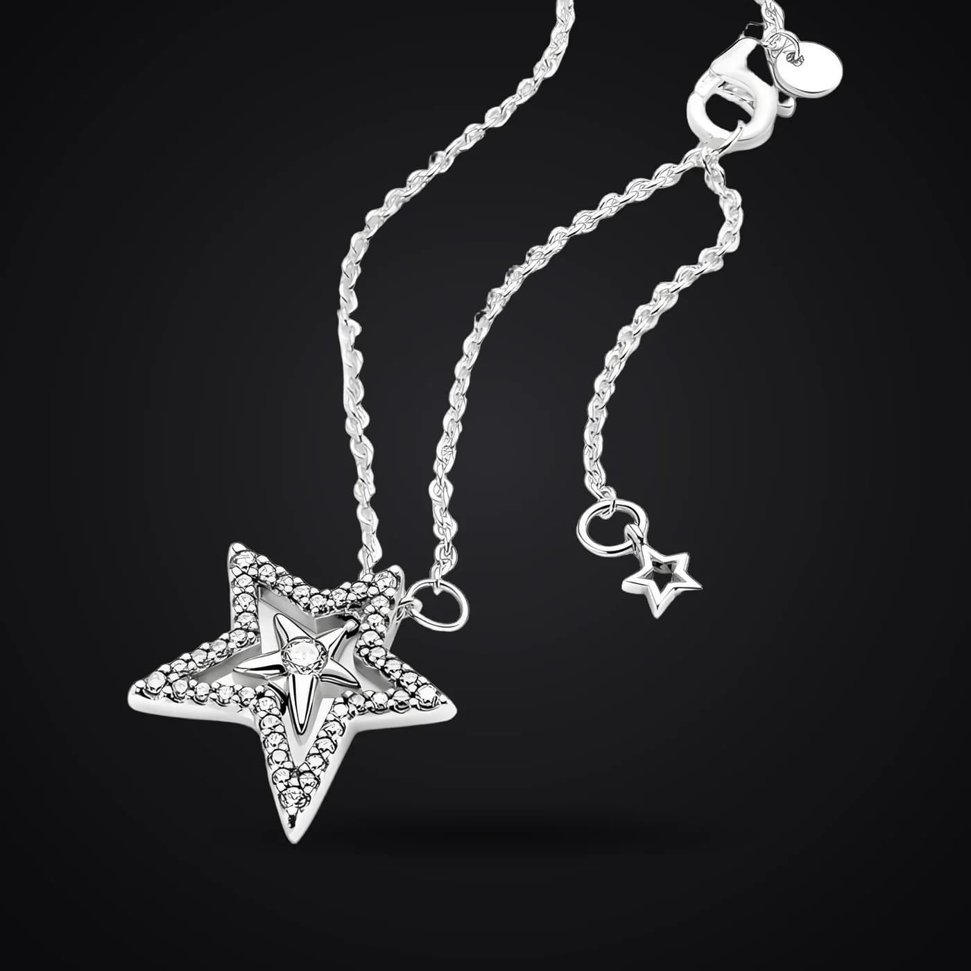 Pavé Star necklace on a dark background