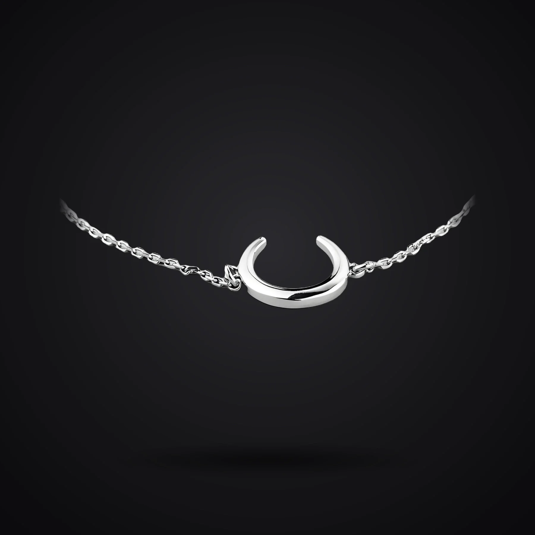 Crescent Moon bracelet on a dark background