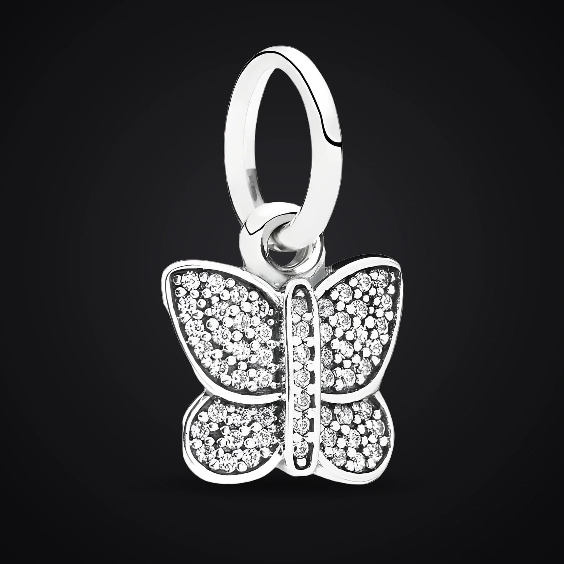 Butterfly charm on a dark background