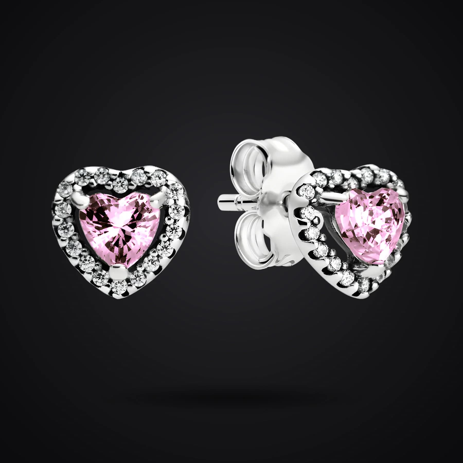 Pink Hearts earrings on a dark background