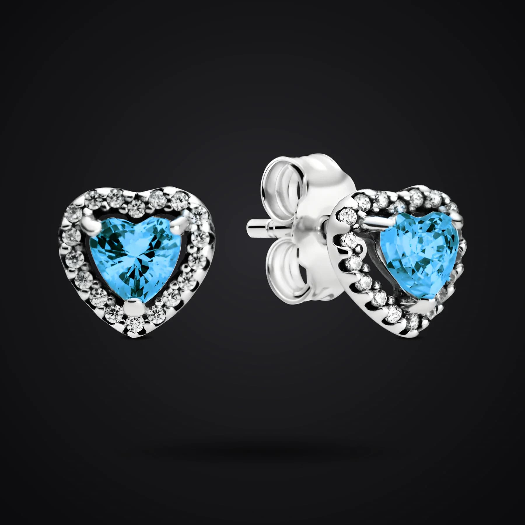 Sky Blue Hearts earrings on a dark background