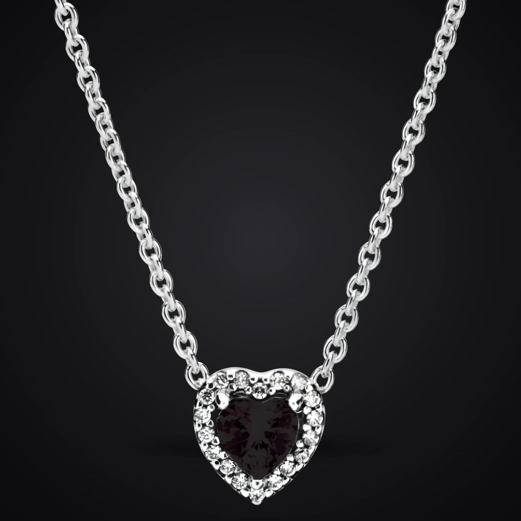 Black Heart necklace on a dark background