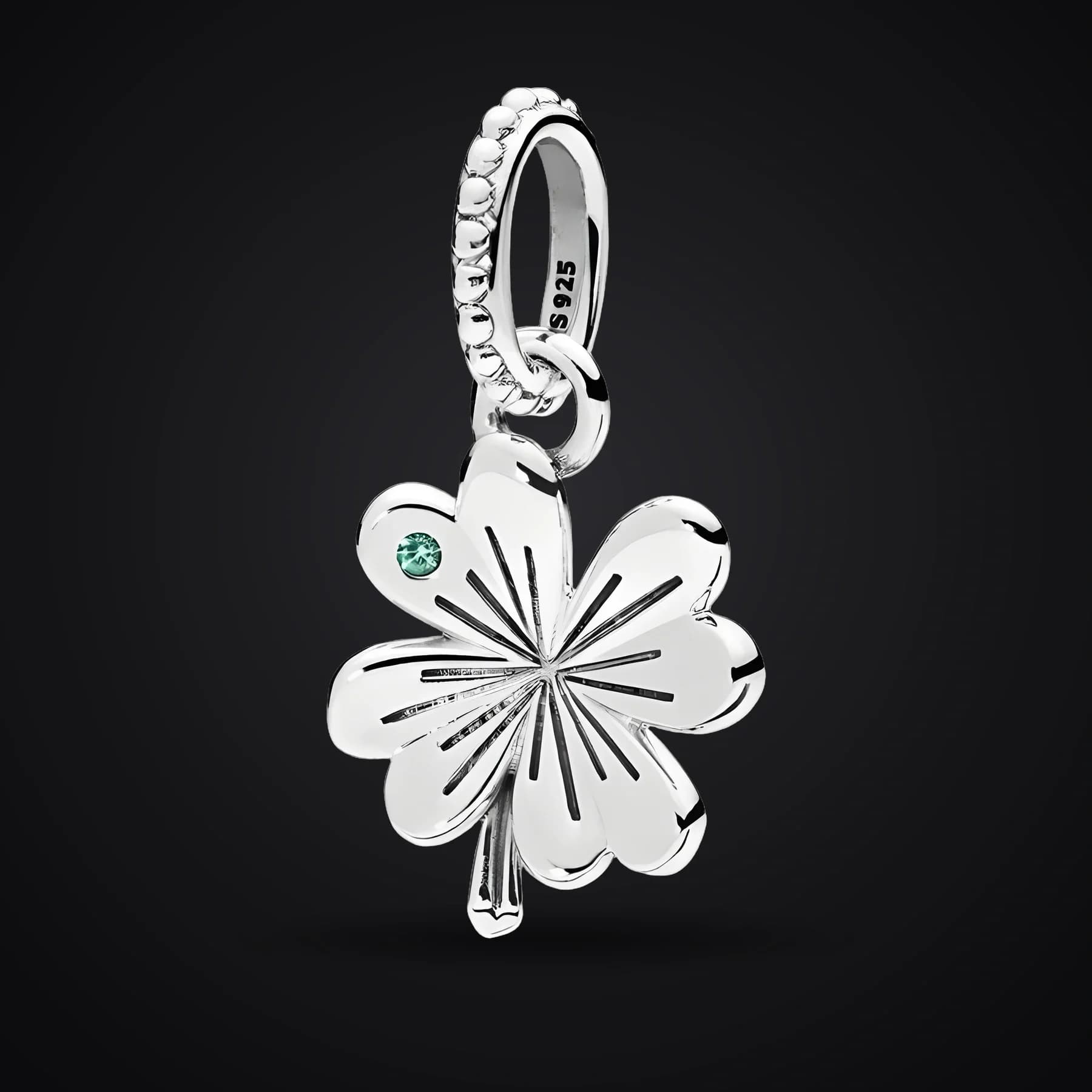 Clover charm on a dark background