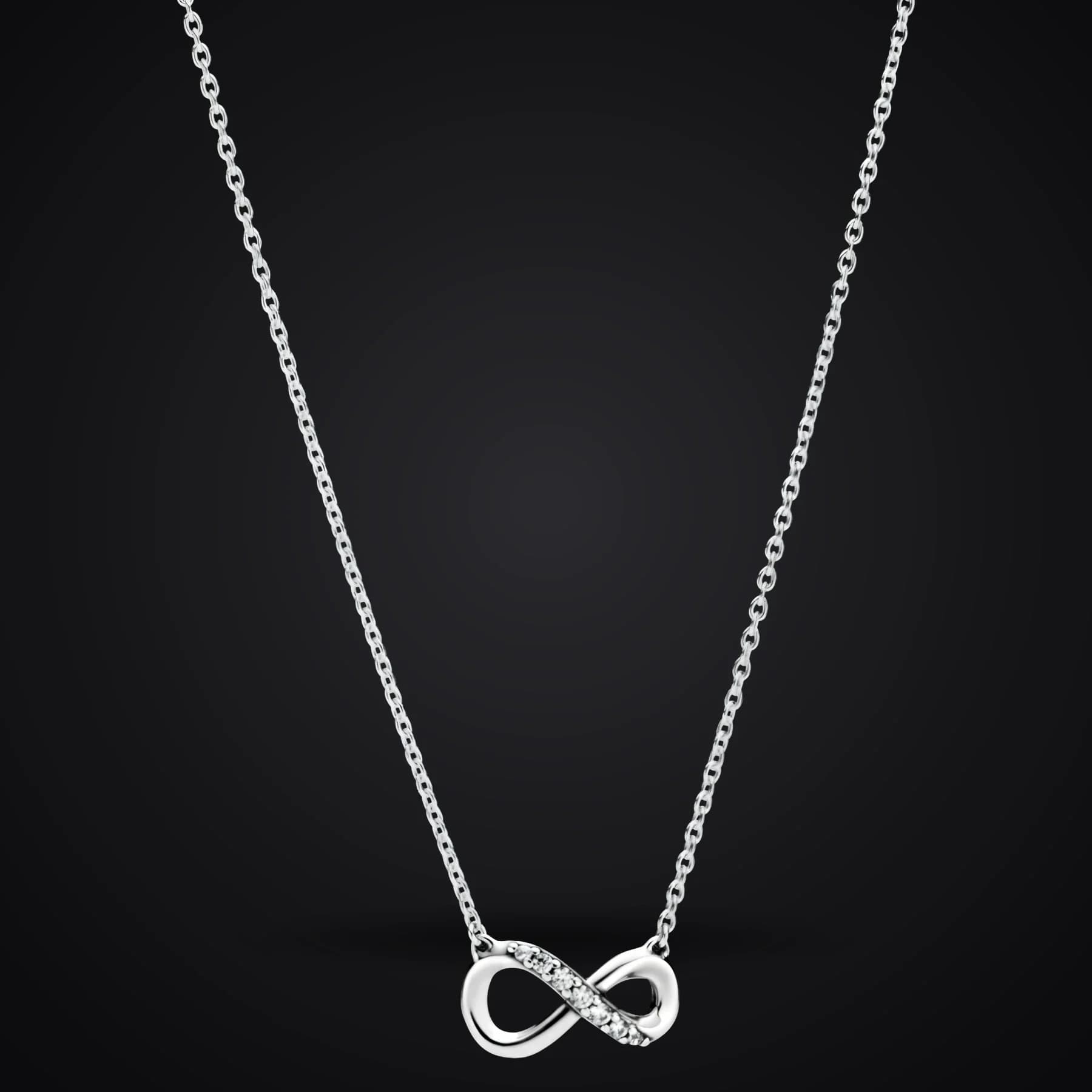 Infinity necklace on a dark background