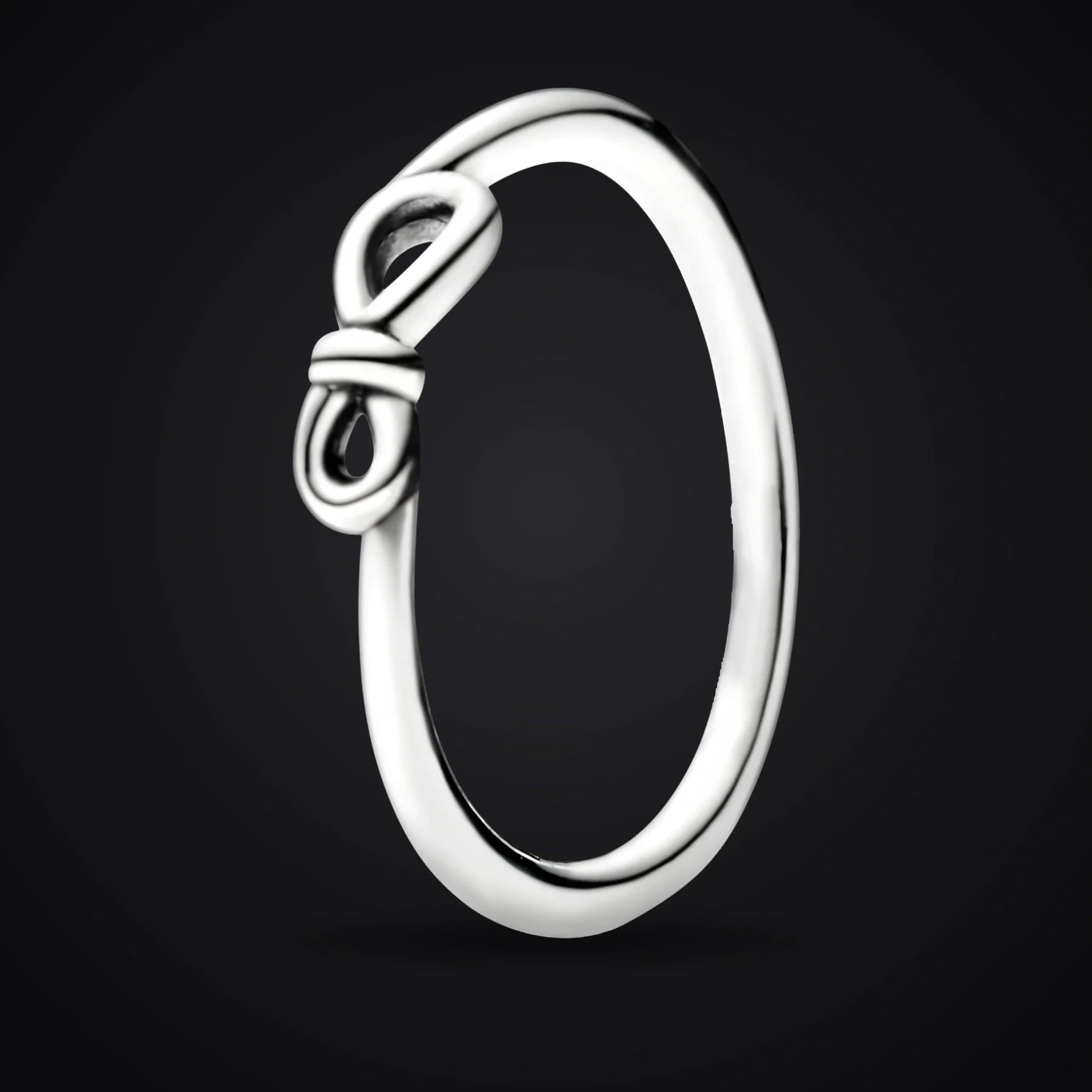 Infinity Knot ring on a dark background