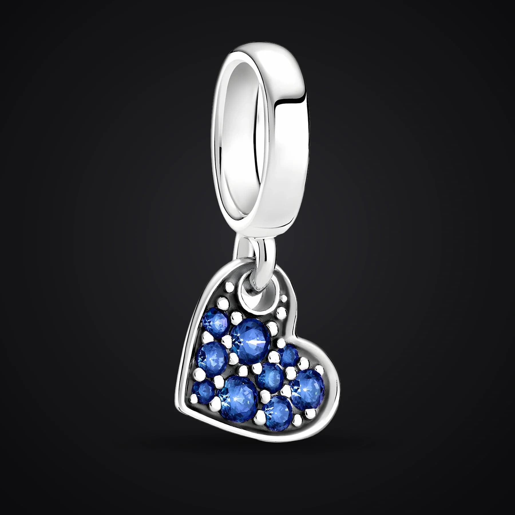 Blue Heart charm on a dark background