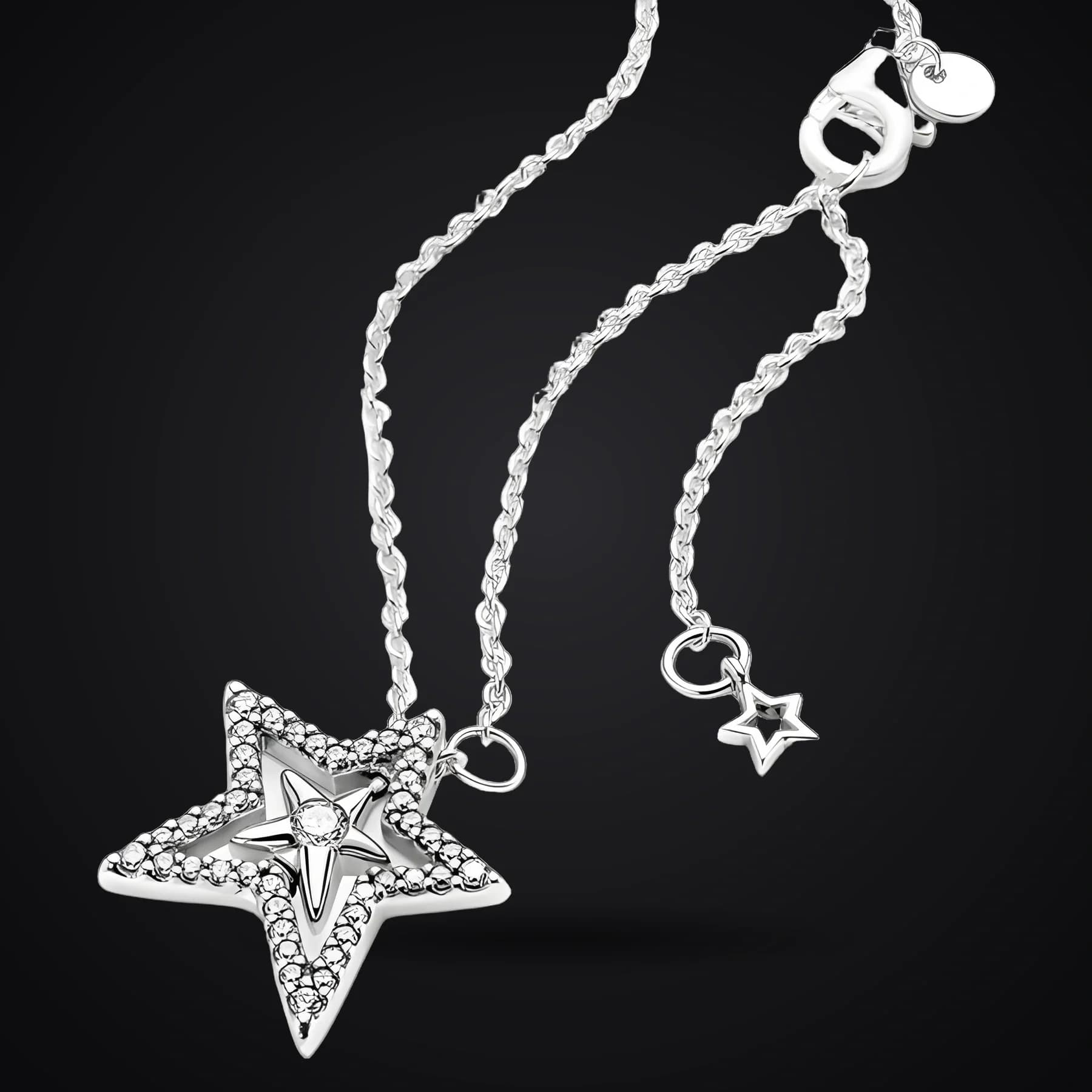 Pavé Star necklace on a dark background