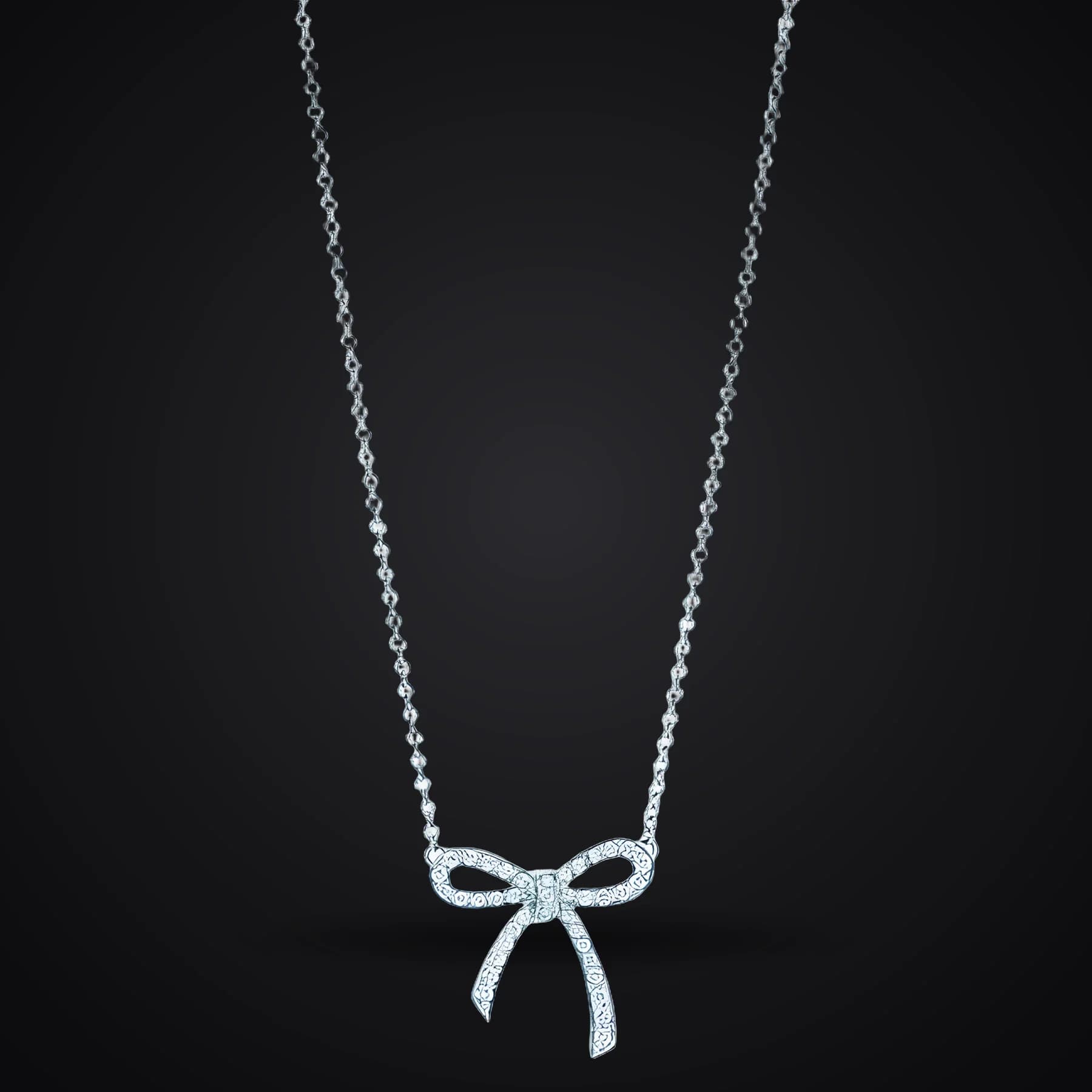 Sparkling Bow necklace on a dark background