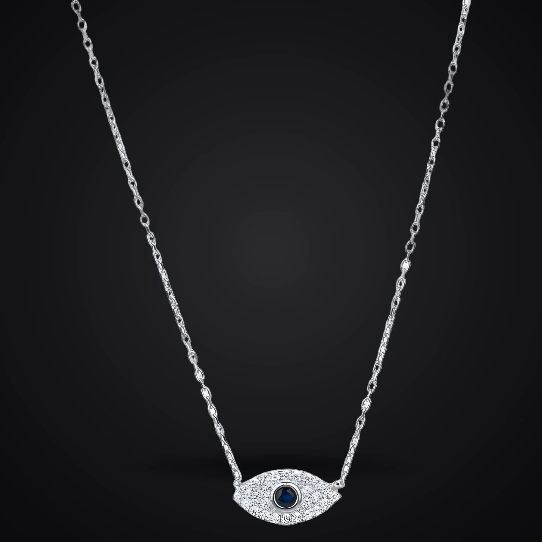Evil Eye necklace on a dark background